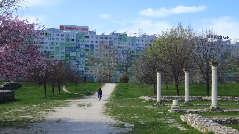 The mighty Faluház behind some roman columns